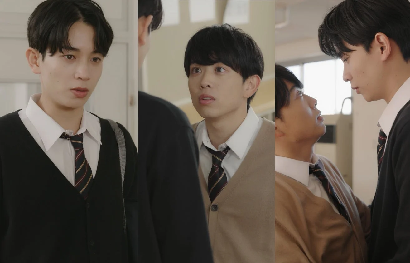 学校の制服を着た2人の若い男性が写っています。彼らは互いに向き合い、驚いたような表情を見せており、緊張感のある一場面を切り取ったドラマチックなシーンです。