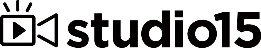 「studio15」という文字と、再生ボタンとビデオカメラを組み合わせたようなアイコンが特徴のロゴ画像です。動画制作やメディア関連の企業ロゴとして使われていると考えられます。